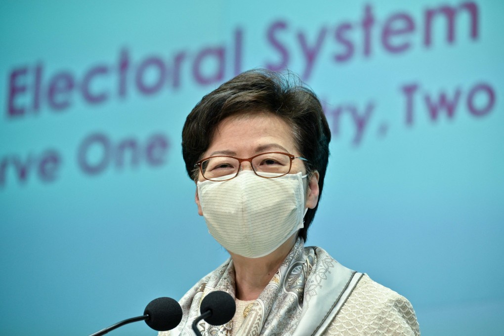 TOPSHOT - Hong Kong Chief Executive Carrie Lam speaks to the press in Hong Kong on March 11, 2021, after electoral changes for the city were voted in by China’s National People’s Congress in Beijing. (Photo by Anthony WALLACE / AFP)