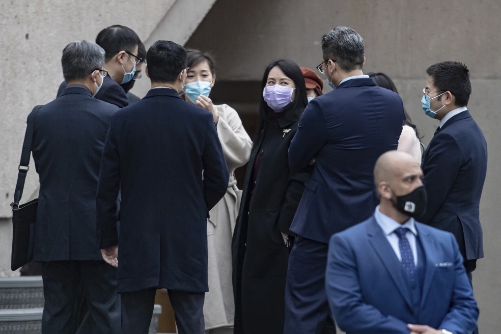 Huawei Technologies chief financial officer Meng Wanzhou, centre, chats with colleagues and Chinese diplomats during a break in her extradition hearing at the Supreme Court of British Columbia in Vancouver on Friday. Photo: AP