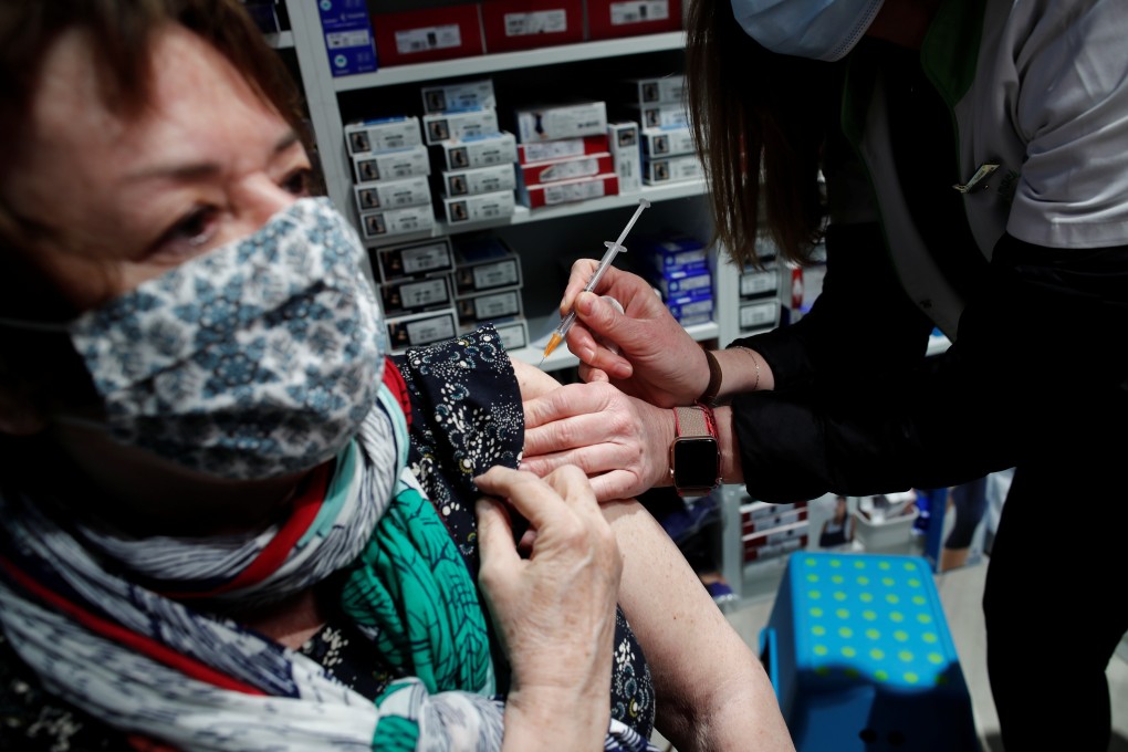 A pharmacist administers the AstraZeneca coronavirus vaccine to a patient in Paris. Photo: Reuters