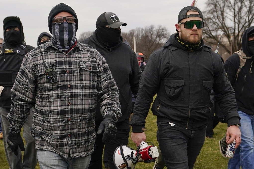 Proud Boys members Joseph Biggs, left, and Ethan Nordean, with megaphone, walk towards the US Capitol in Washington on January 6. Photo: AP