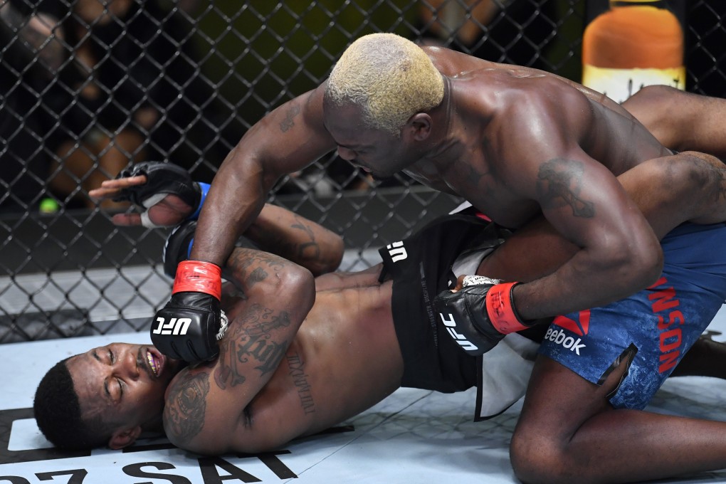 Derek Brunson punches Kevin Holland in their middleweight bout during the UFC Vegas 22 main event. Photos: Chris Unger/Zuffa LLC via Getty Images