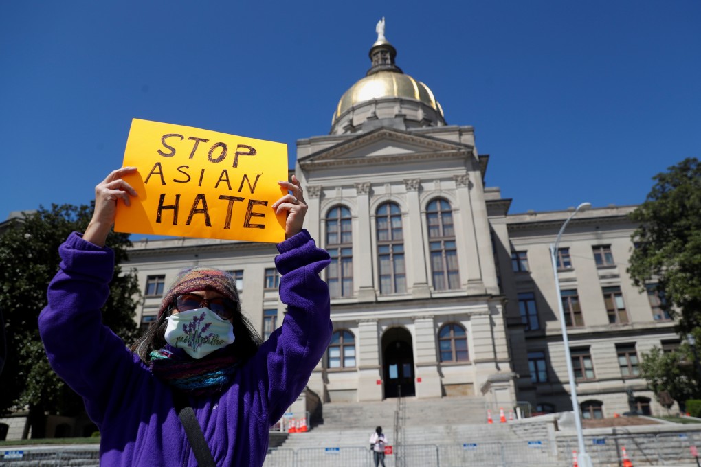 A protester holds a placard reading ‘Stop Asian Hate’ during a rally following deadly shootings in Atlanta, Georgia on Saturday. Photo: Reuters