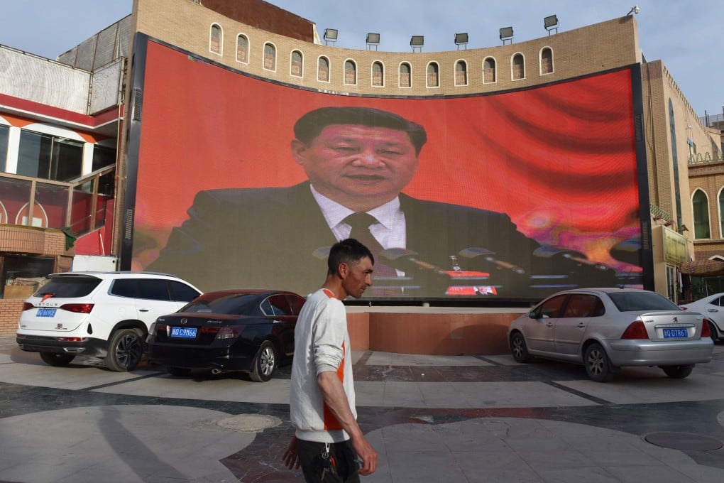 Chinese President Xi Jinping is seen on a large screen in the Xinjiang city of Kashgar in 2019. Photo: AFP