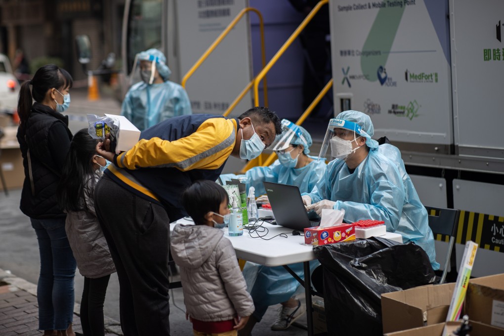 Members of Hong Kong’s ethnic minority community register for a Covid-19 test at one of the city’s mobile testing stations. Photo: EPA-EFE