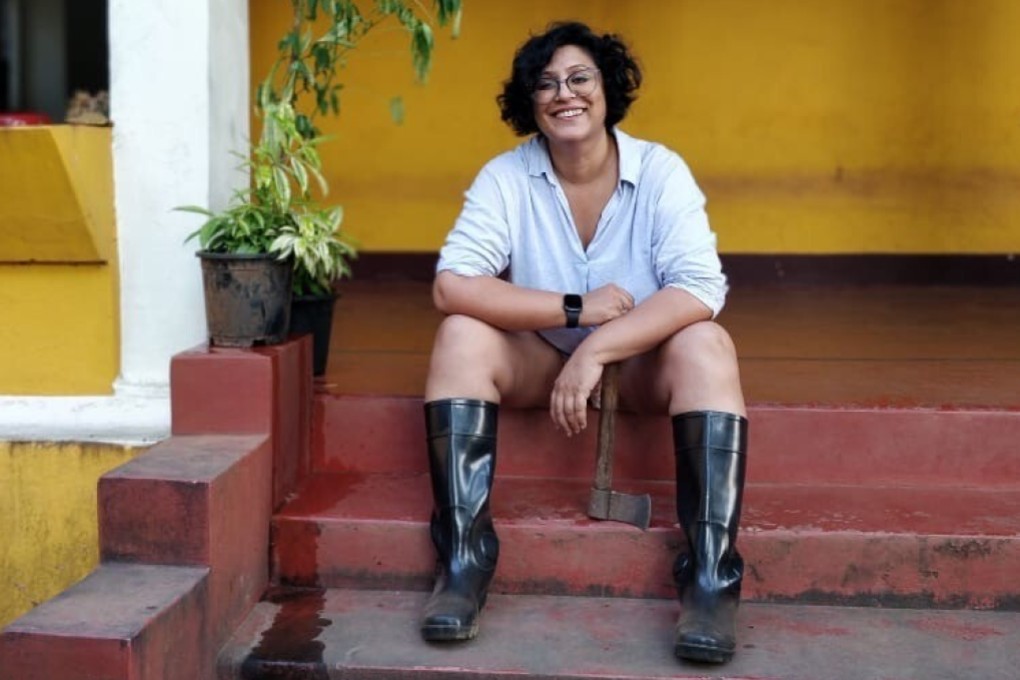 Ruchira Bose, who left Mumbai for Goa last year, sits on the steps of her new home. Photo: Suranjana Ghosh