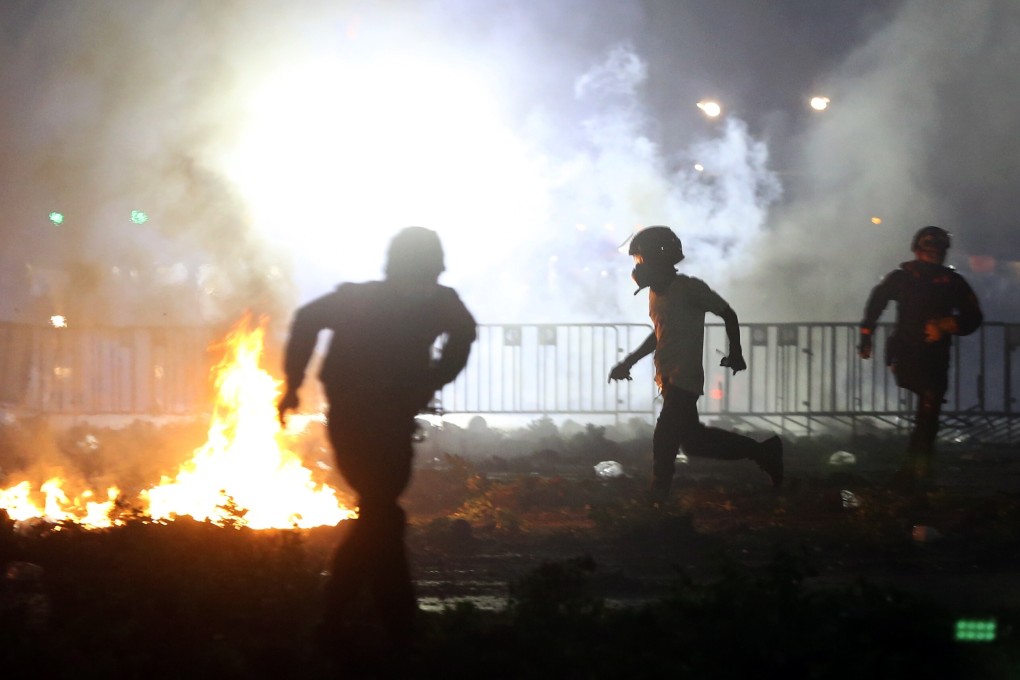 Anti-government protesters burn tyres and objects as they clash with police in Bangkok on March 20, 2021. Photo: EPA-EFE