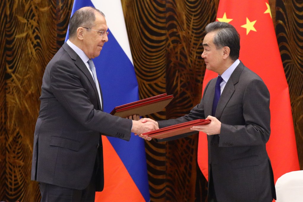 Russian Foreign Minister Sergey Lavrov (left) shakes hands with his Chinese counterpart Wang Yi in Guilin on Tuesday. Photo: Reuters