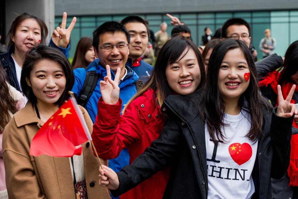 Chinese students wait to greet President Xi Jinping on a 2015 visit to Manchester University. Britain is the most favoured academic destination for Chinese students, according to a recent survey. Photo: AFP
