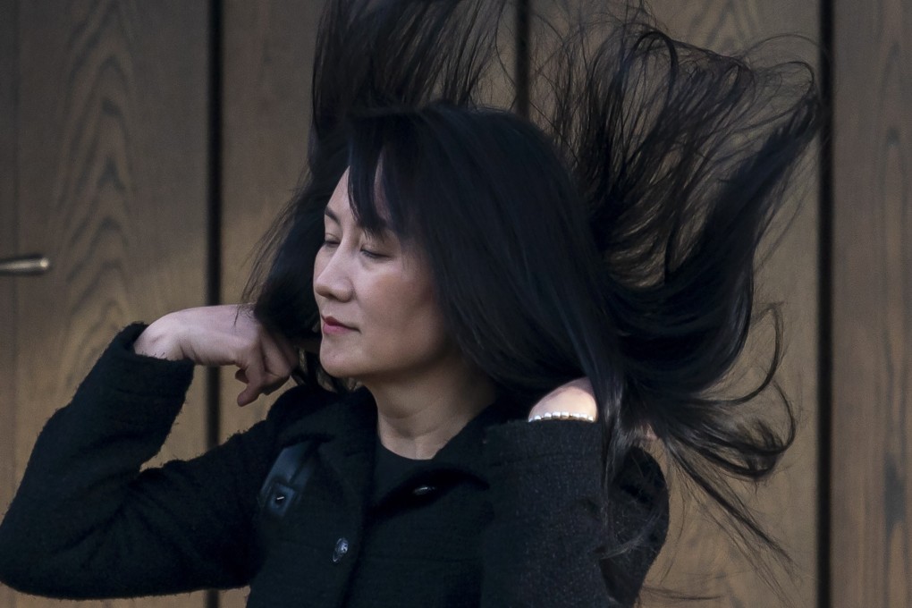 Meng Wanzhou’s hair is caught in a gust of wind as she leaves her home in Vancouver to attend her hearing at the Supreme Court of British Columbia on Thursday. Photo: AP
