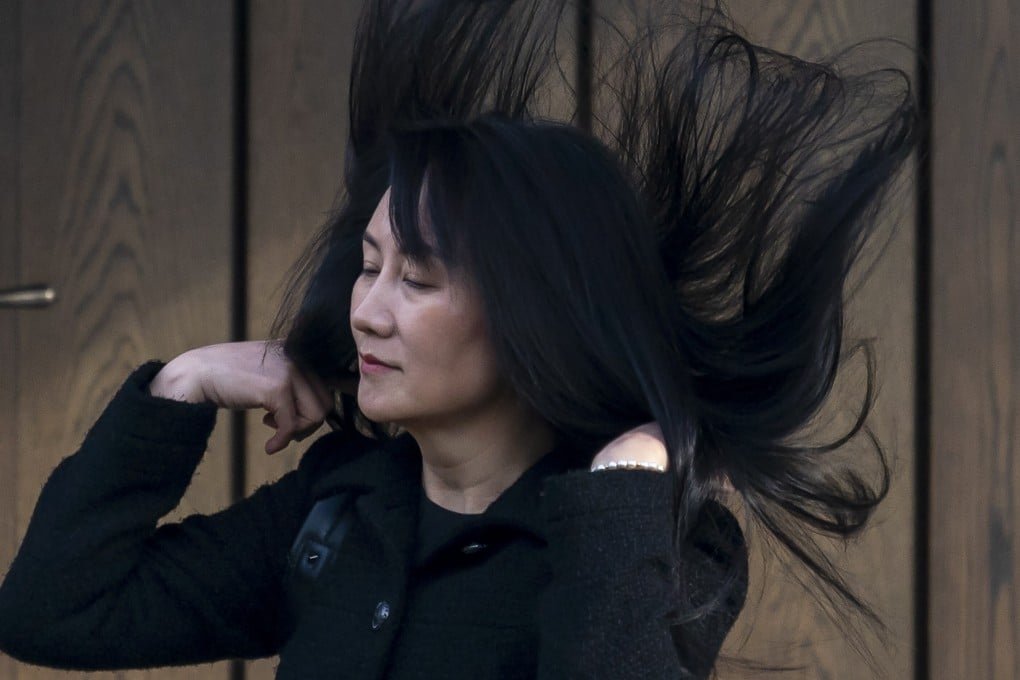 Meng Wanzhou’s hair is caught in a gust of wind as she leaves her home in Vancouver to attend her hearing at the Supreme Court of British Columbia on Thursday. Photo: AP
