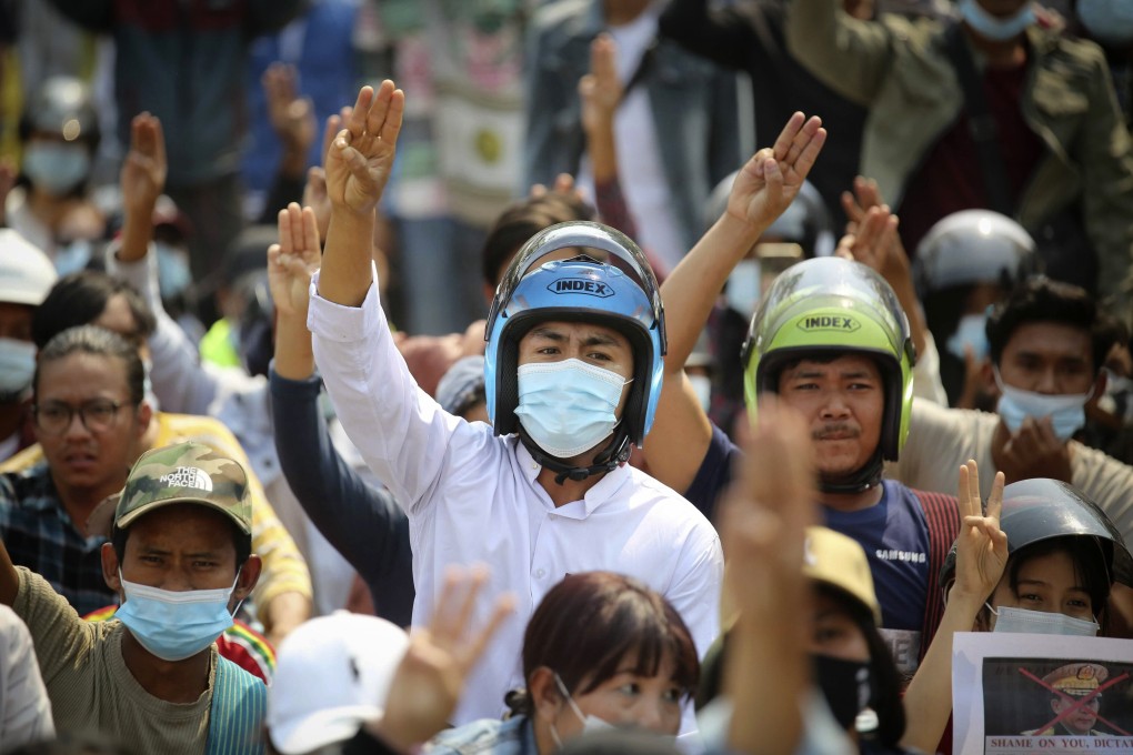 Anti-coup protesters flash a three-fingered sign of resistance during a demonstration in Naypyitaw, Myanmar on March 8. Photo: AP