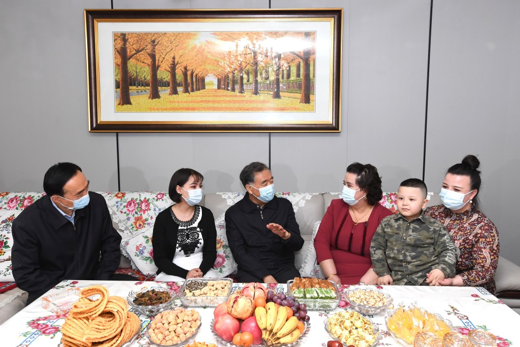 Wang Yang pictured during a visit to a Uygur family in Urumqi, the region’s capital. Photo: Xinhua