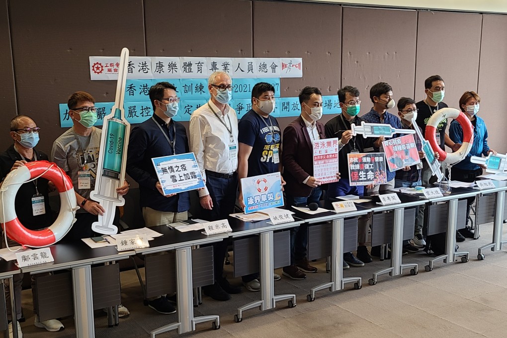 Members of the swimming community at a press conference at Legco demanding to know why the government has kept pools closed while other sports have been allowed to resume. Photo: Patrick Blennerhassett