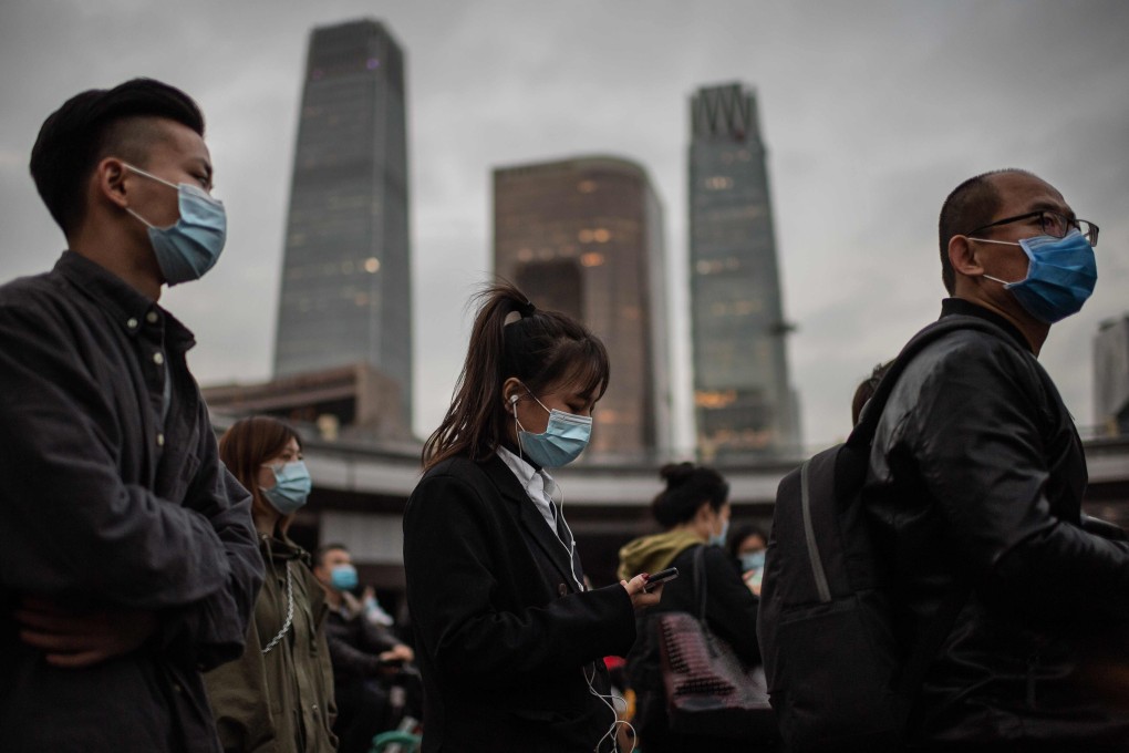 People wearing face masks during rush hour in Beijing. Photo: AFP