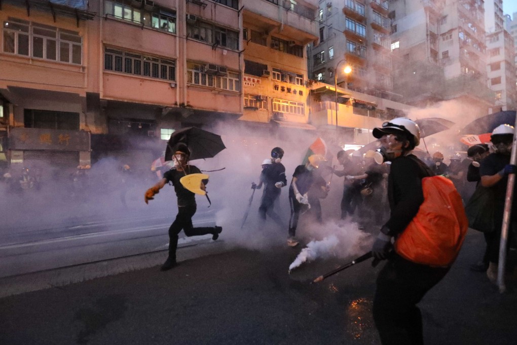 Riot police fire tear gas at anti-extradition bill protesters in Sai Ying Pun, Hong Kong, July 2019. Photo: Felix Wong
