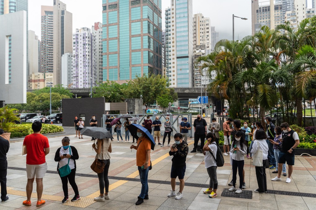 People stand in line outside a community vaccination centre in Hong Kong on April 5. Photo: Bloomberg