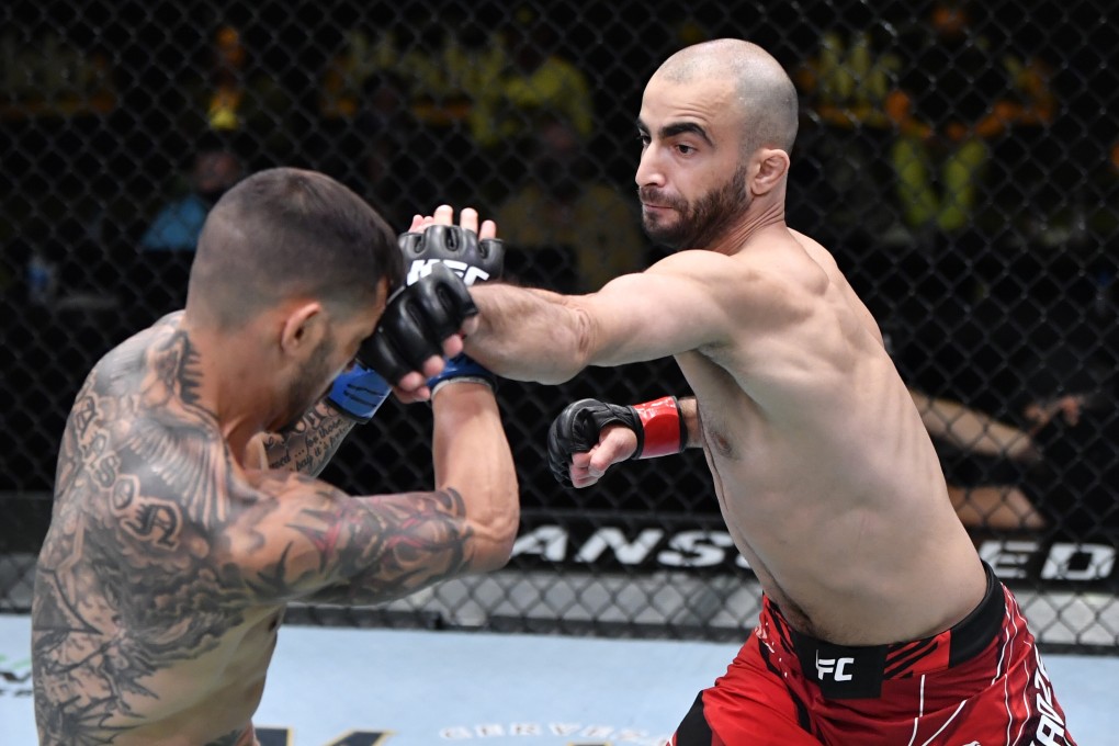 Giga Chikadze punches Cub Swanson in their featherweight bout at UFC Vegas 25. Photos: Jeff Bottari/Zuffa LLC