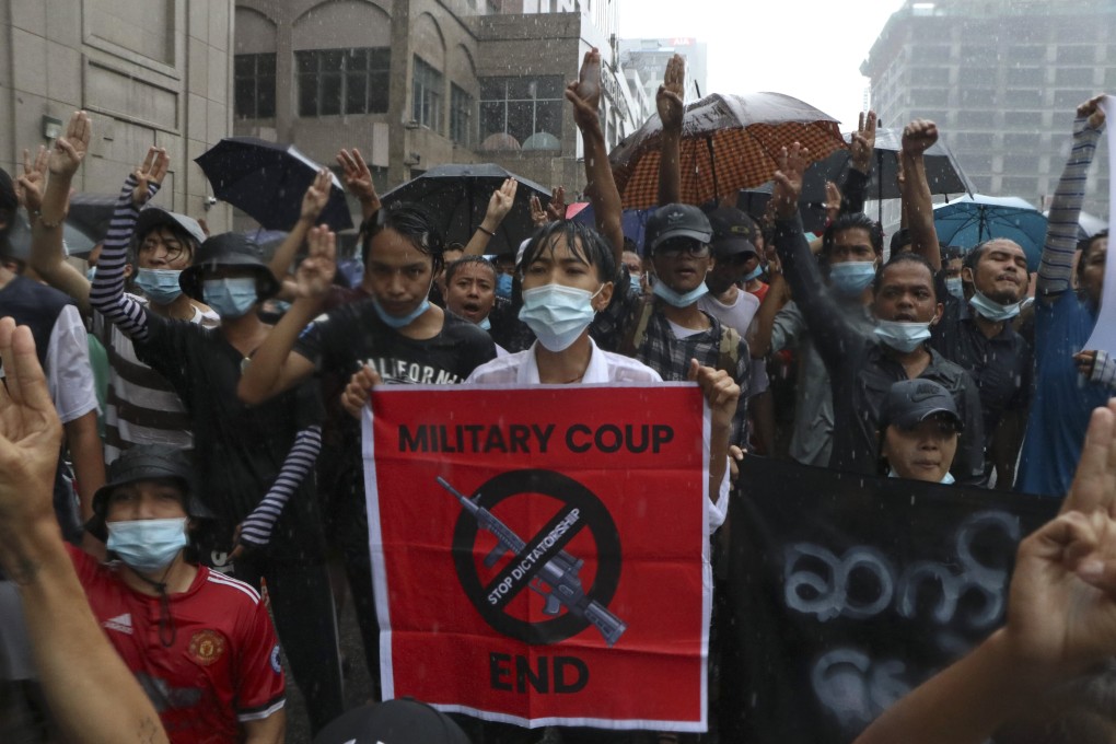 Anti-coup protesters flash the three-finger salute during a demonstration at Pabedan township in Yangon, Myanmar. Photo: AP