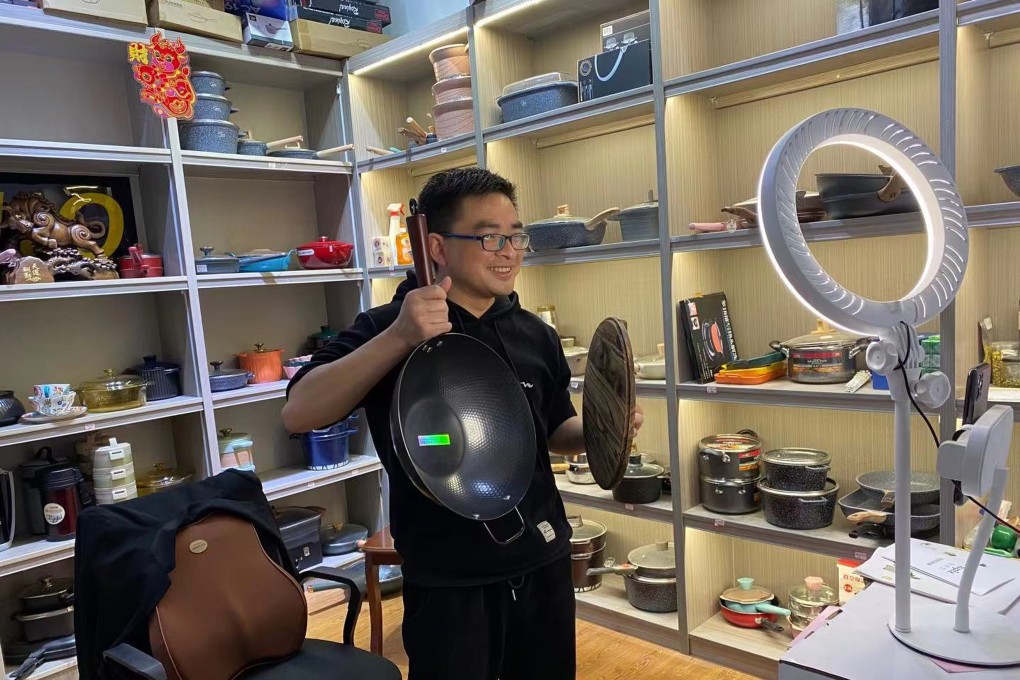 Zheng Liuping selling a wok while live-streaming in Beixiazhu village. Photo: Handout