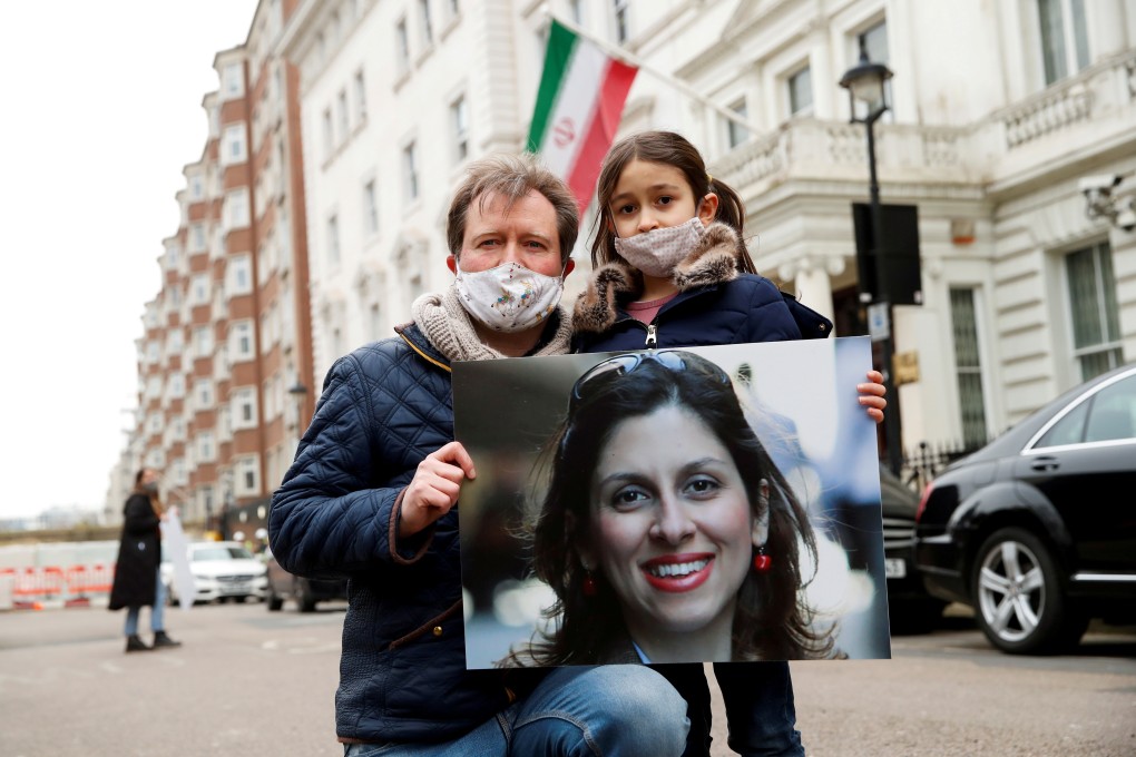 Richard Ratcliffe, husband of British-Iranian aid worker Nazanin Zaghari-Ratcliffe, and their daughter Gabriella outside the Iranian embassy in London, UK in March. Photo: Reuters