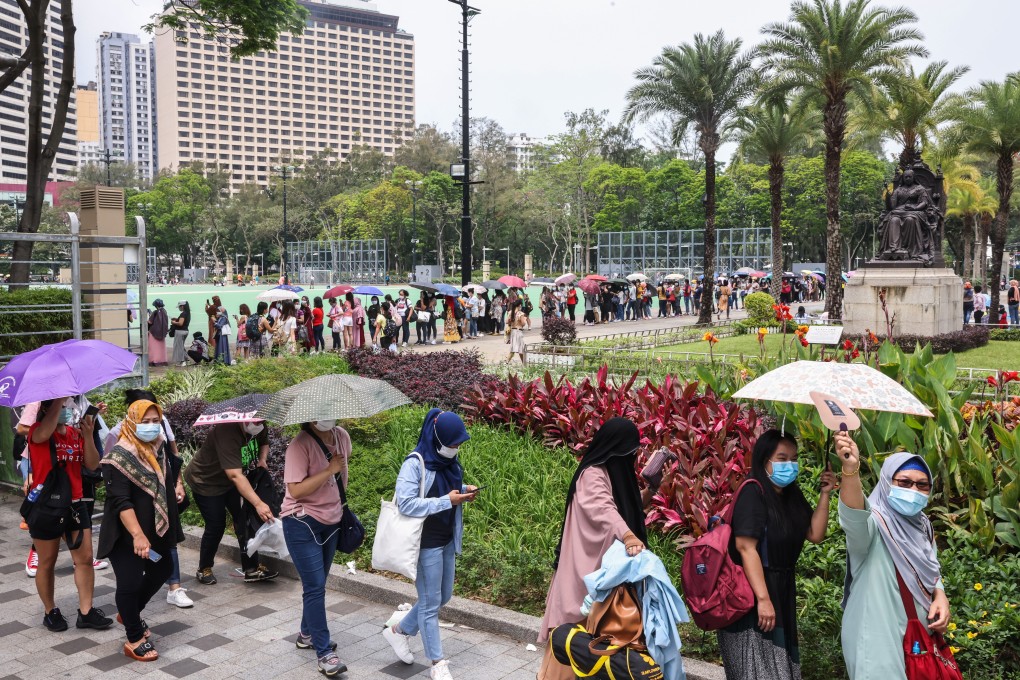 Domestic helpers queue up at Victoria Park for Covid-19 tests. Photo: K. Y. Cheng