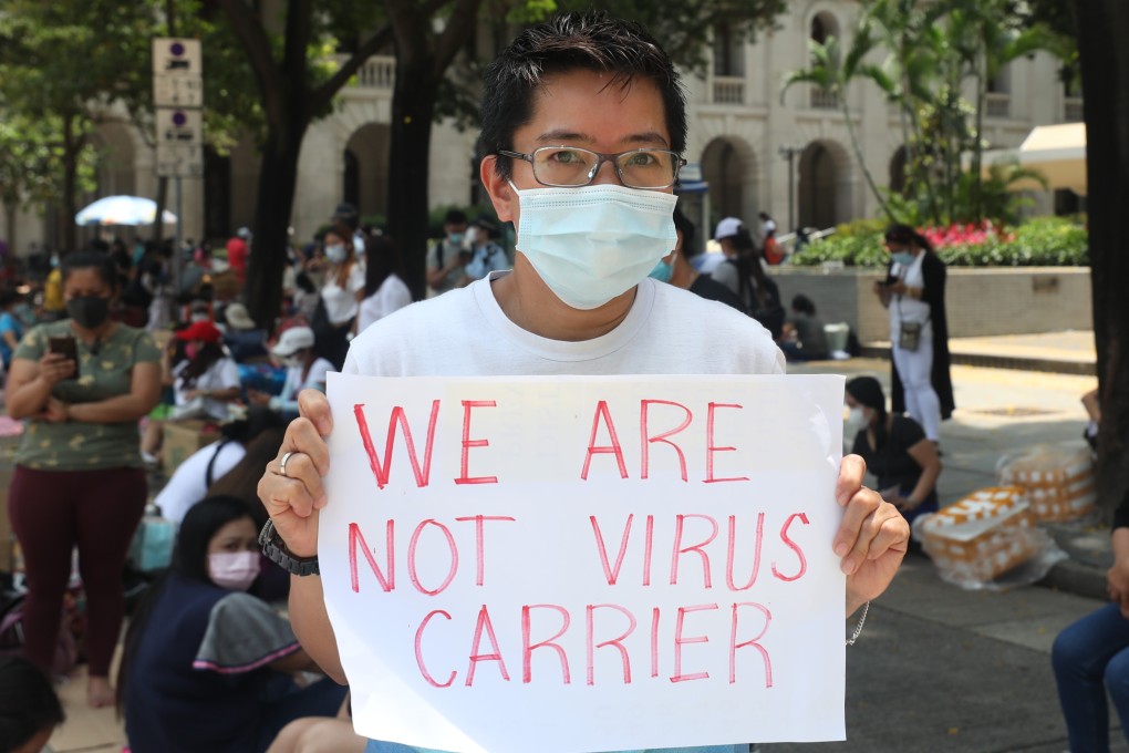Domestic workers wait for a Covid-19 test in Central. Photo: Xiaomei Chen