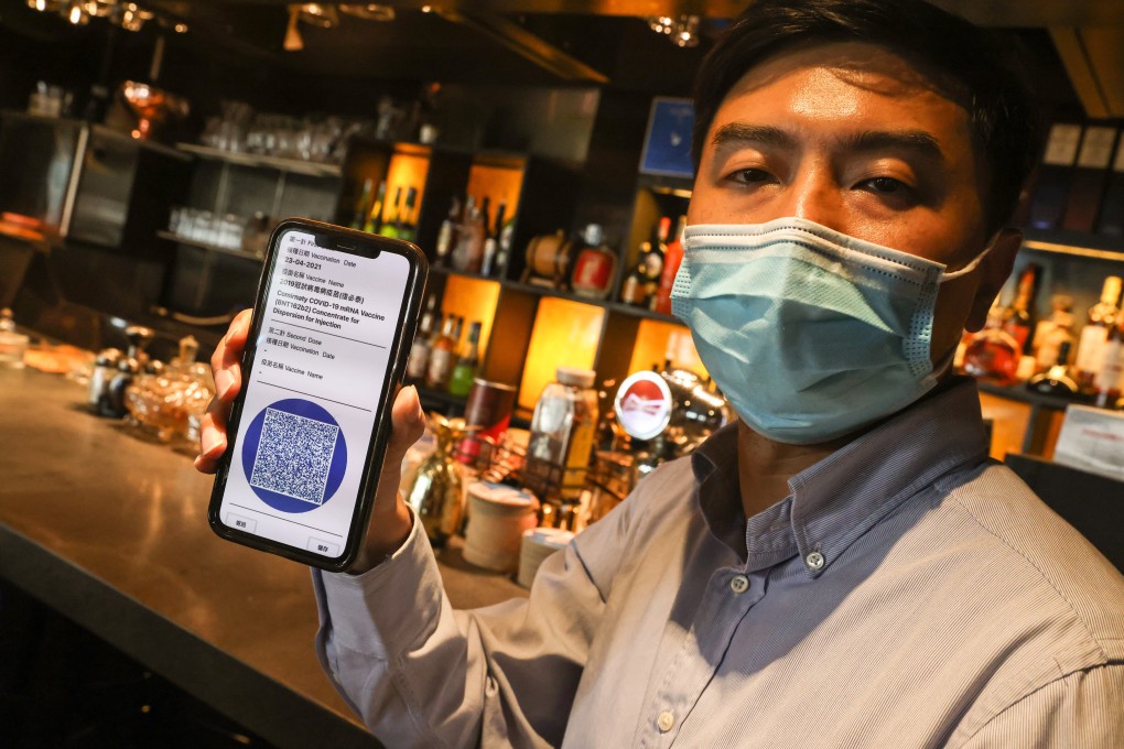 Wing Chin Chun-wing, president of the Hong Kong Bar and Club Association, shows the QR code that patrons are asked to display for proof of vaccination before entering a bar, at an interview on April 29. Photo: K.Y. Cheng
