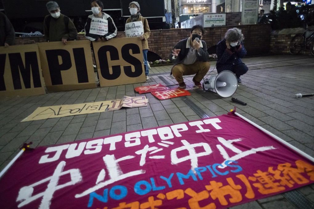 A ‘No Olympics’ banner put in front of local protesters demonstrating against the Tokyo 2020 Olympic and Paralympic Games in June. Photo: AP