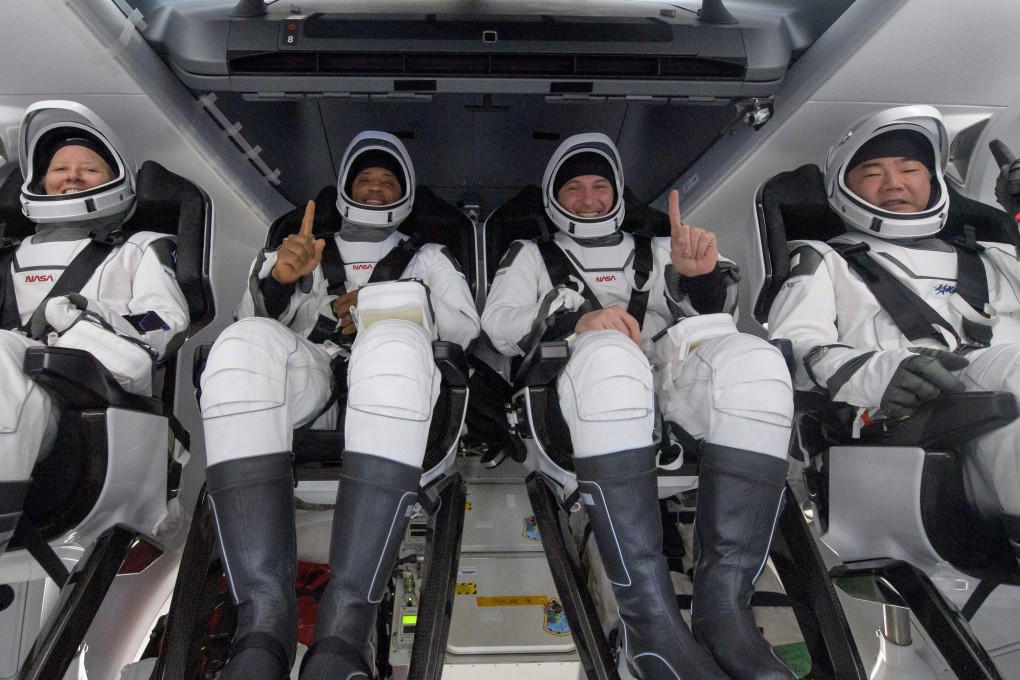 Astronauts Shannon Walker (left), Victor Glover, Mike Hopkins and Soichi Noguchi inside the SpaceX Crew Dragon capsule after it landed in the Gulf of Mexico off Panama City. Photo: Nasa via AFP