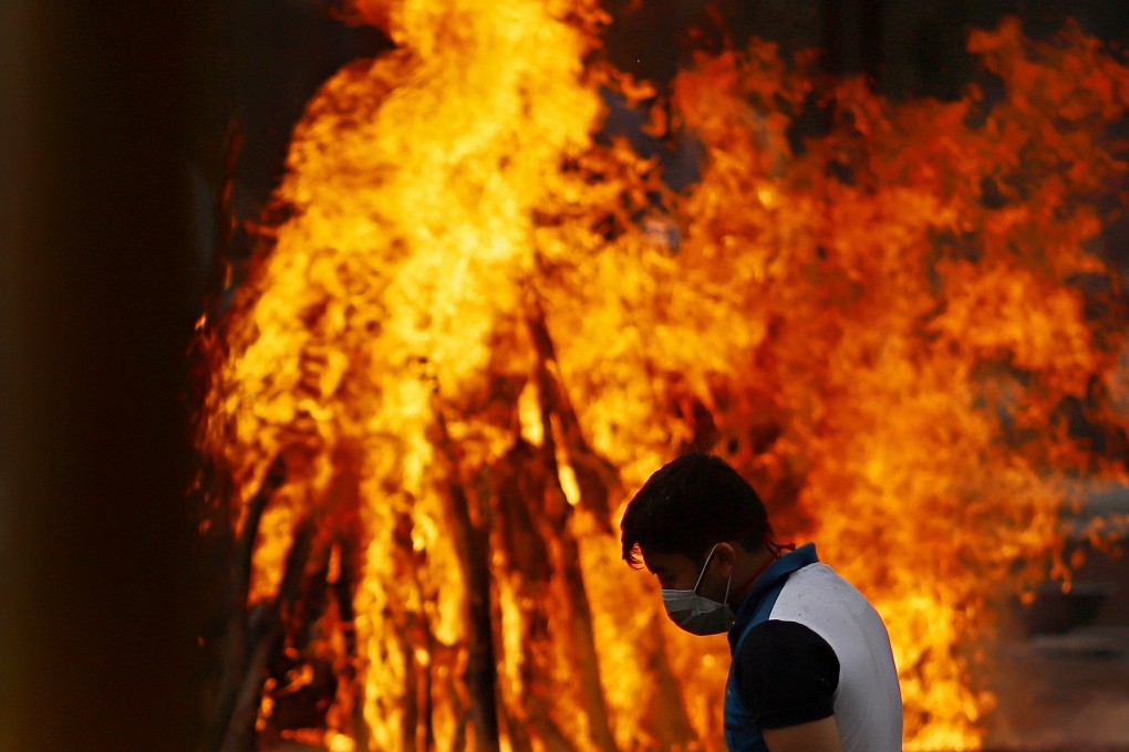 As images of cremation pyres and gasping patients were seen around the world, foreign governments began to take action and supplies started trickling in. Photo: Bloomberg
