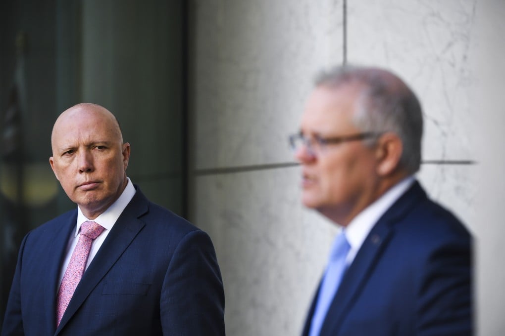 Australian Prime Minister Scott Morrison (right) speaks alongside then Home Affairs minister Peter Dutton at Parliament House in Canberra, Australia, on August 6, 2020. Photo: EPA-EFE