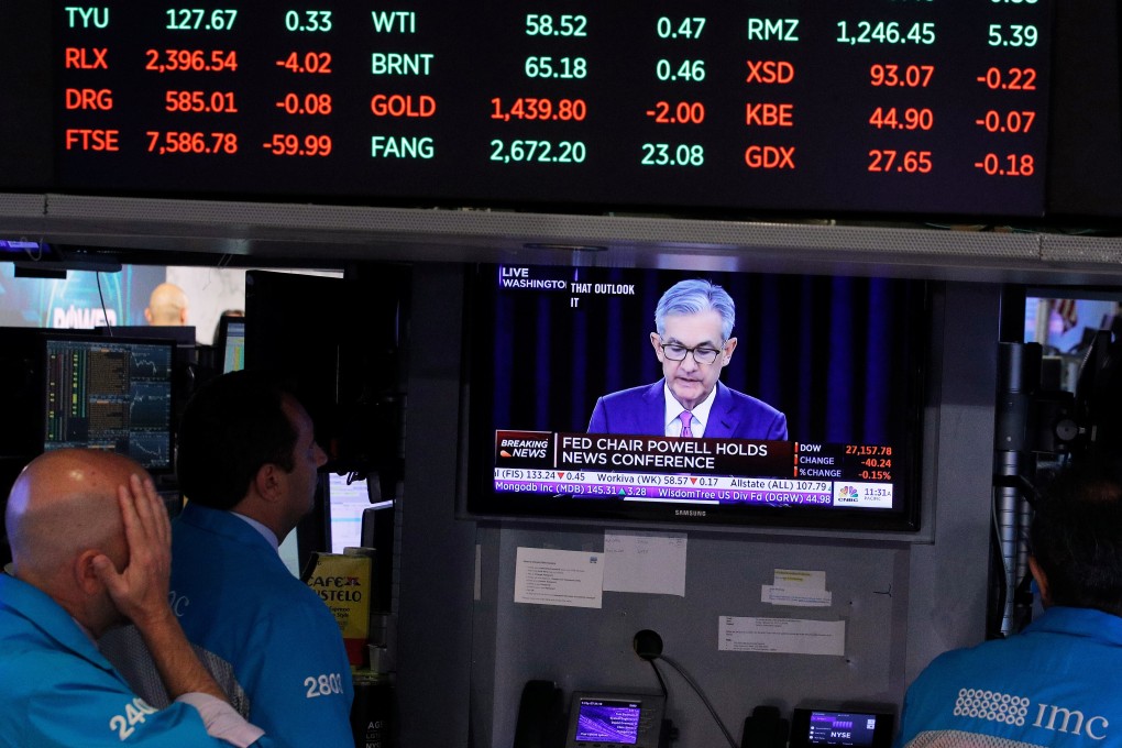 New York Stock Exchange traders watch Federal Reserve chairman Jerome Powell’s news conference on July 31, 2019. If investors reject the Fed’s narrative that inflation is transitory, then support for US bonds and the dollar will weaken. Photo: Reuters