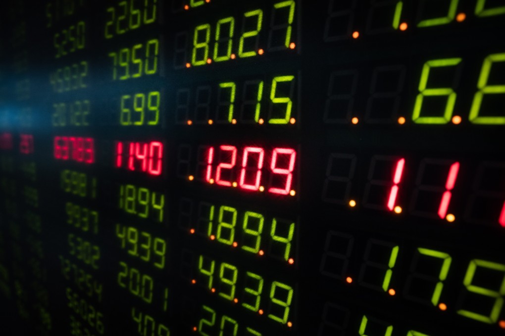 An electronic board displays Chinese stock prices at a securities brokerage in Shanghai. Photo: EPA-EFE