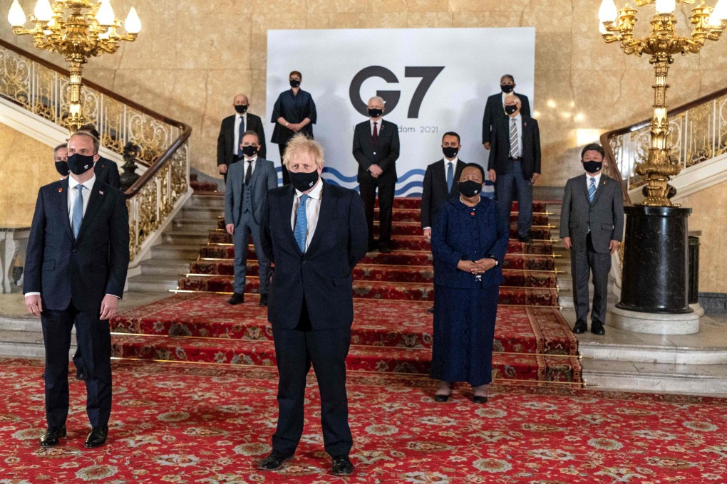 Britain's Prime Minister Boris Johnson (centre) and Foreign Secretary Dominic Raab (left) posing for a photograph with other delegates during the G7 foreign ministers meeting in London on Wednesday. Photo: Niklas Halle'n/European Commission via AFP