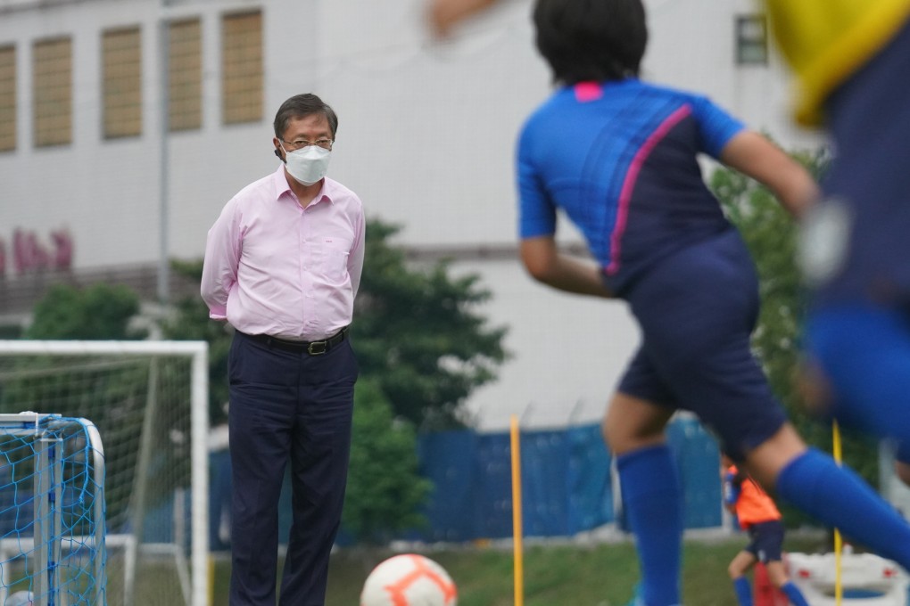 Kitchee president and youth academy founder Ken Ng Kin watches young players train at the Jockey Club Kitchee Centre at Shek Mun in Sha Tin. Photo: Winson Wong