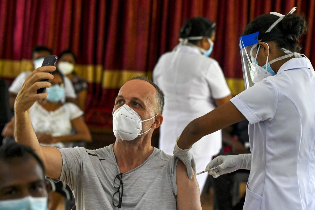 A health worker inoculates a man with a dose of the Sputnik V Covid-19 vaccine in Colombo, Sri Lanka. Photo: AFP