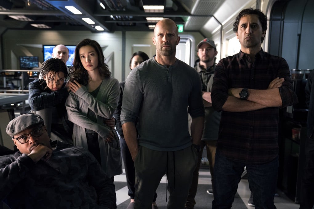 Li Bingbing (third, left) and Jason Statham (centre) lead an international cast in The Meg (2018). Despite negative reviews, the film made US$530 million worldwide to be the highest-grossing Chinese-American co-production of all time.