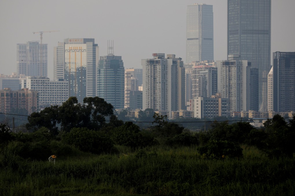 A farmer works in a field at Lok Ma Chau village in Hong Kong. File photo: Reuters
