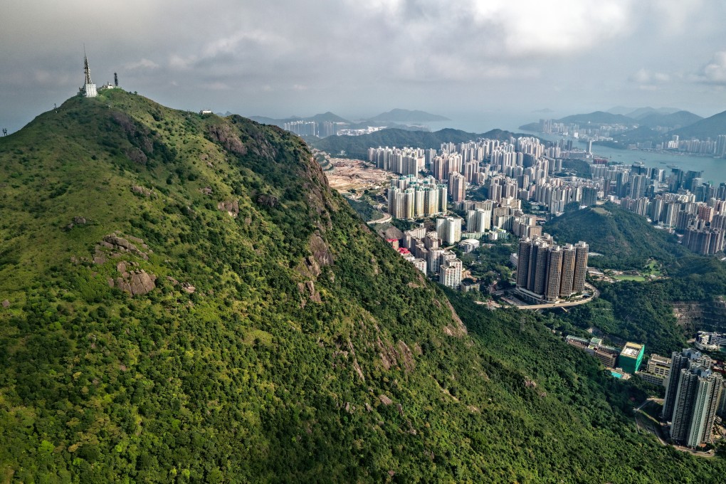 Paul Cheung Chi-fai climbs a route on Devil’s Peak, Kowloon Peak (pictured) and Lion Rock, running between each of them, in 24 hours. Photo: Martin Williams