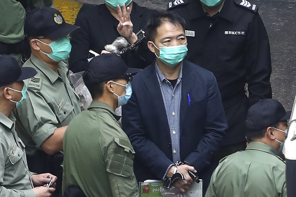 Former Hong Kong lawmaker Wu Chi-wai walks to a prison van on his way to a national security law hearing in March. Photo: Handout