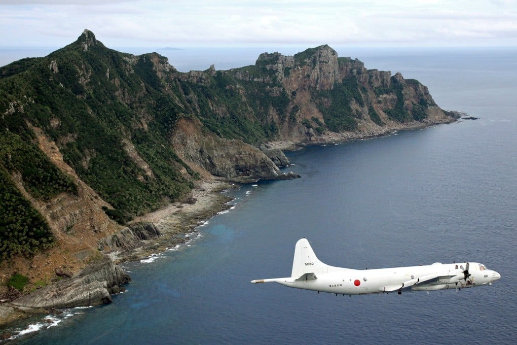 A Japan Maritime Self-Defence Force surveillance plane flies over the disputed Diaoyu Islands in the East China Sea, which Japan calls the Senkaku Islands. Tokyo is enhancing its defence capabilities in new domains with a focus on defending its territory. Photo: Kyodo
