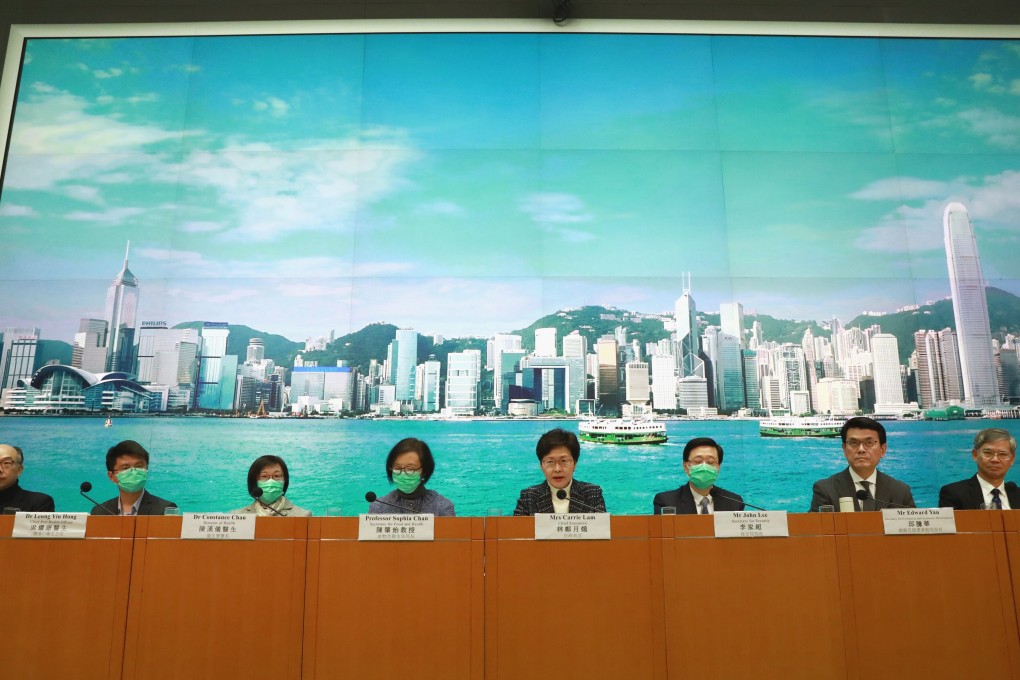 Chief Executive Carrie Lam Cheng Yuet-ngor (centre) and her ministers meet the press at the government headquarters in Admiralty in February 2020. Photo: May Tse