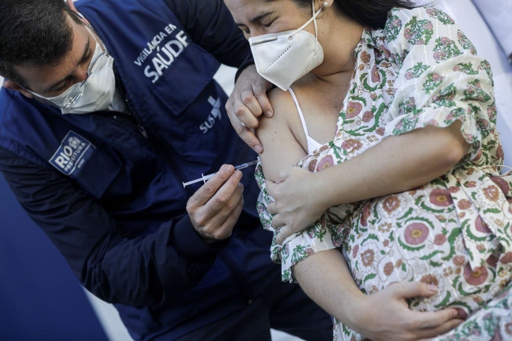 A pregnant woman gets vaccinated against Covid-19 in Rio de Janeiro, Brazil. Photo: Reuters