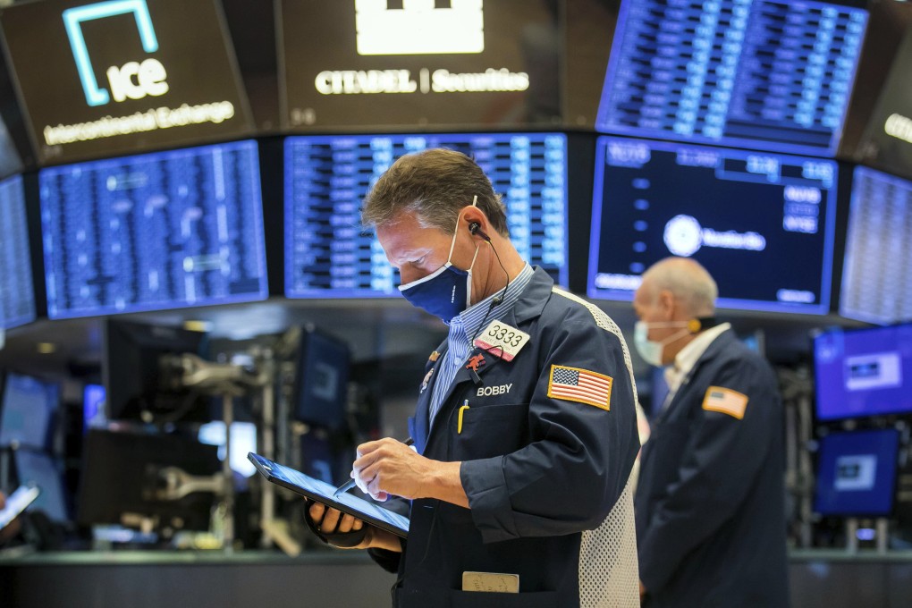 Traders work on the floor of the New York Stock Exchange on April 26. Investors are right to fret over tax increases reducing corporate profits, impinging on equity returns in the coming year. Photo: AP