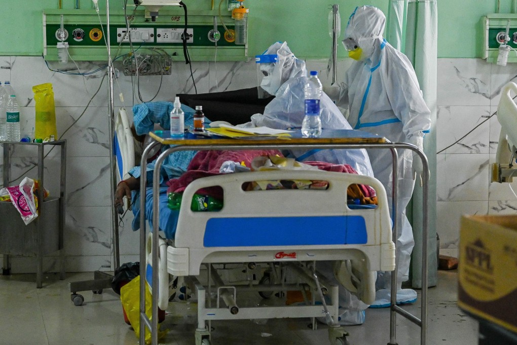 India health workers wearing personal protective equipment tend to a Covid-19 patient at a hospital in Moradabad. Photo: AFP