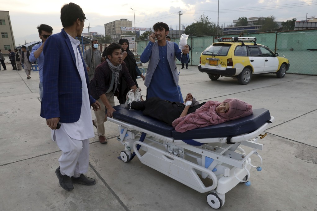 An injured school student is transported to a hospital in Kabul. Photo: AP
