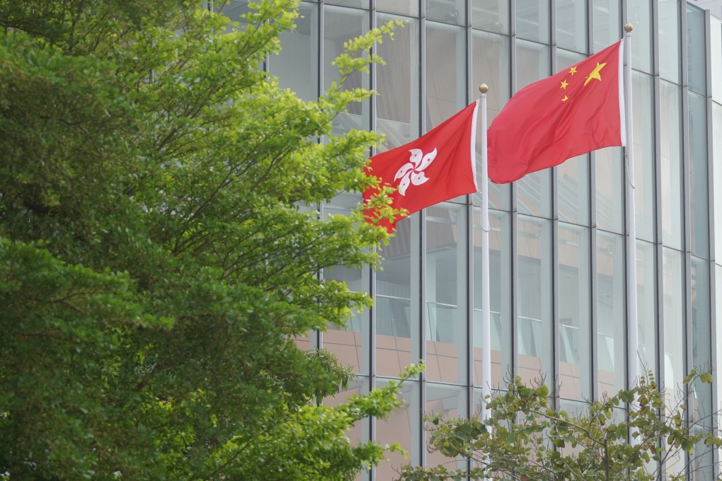 The flags of Hong Kong and China fly outside the Legislative Council building in Admiralty, on March 30. Photo: Winson Wong