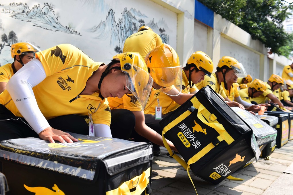 Food delivery drivers for Meituan in the Shandong provincial capital of Jinan in eastern China on July 20, 2017. Photo: Xinhua