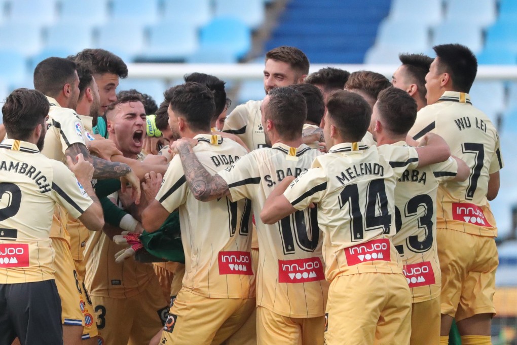 Espanyol’s players, including Wu Lei (right), celebrate promotion to La Liga after their 0-0 draw with Real Zaragoza at La Romareda stadium. Photo: EPA