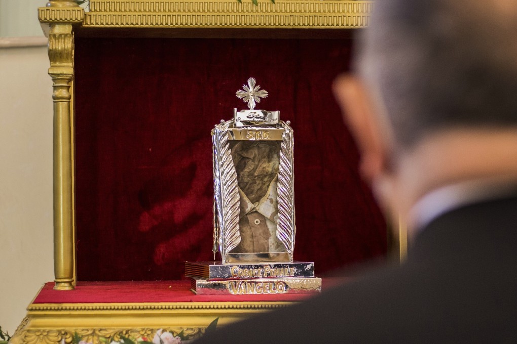 The blood-soaked shirt worn by magistrate Rosario Livatino when he was killed in 1990 is displayed at the Agrigento cathedral in Sicily on Sunday. Photo: LaPresse via AP